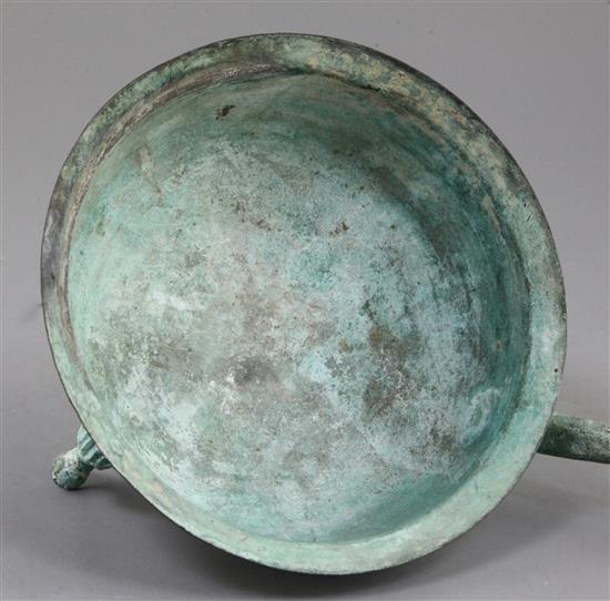 A Chinese archaic bronze tripod wine-warming vessel, Jiao Dou, Eastern Han dynasty, 1st-3rd century A.D., 13.5cm high, 32cm long